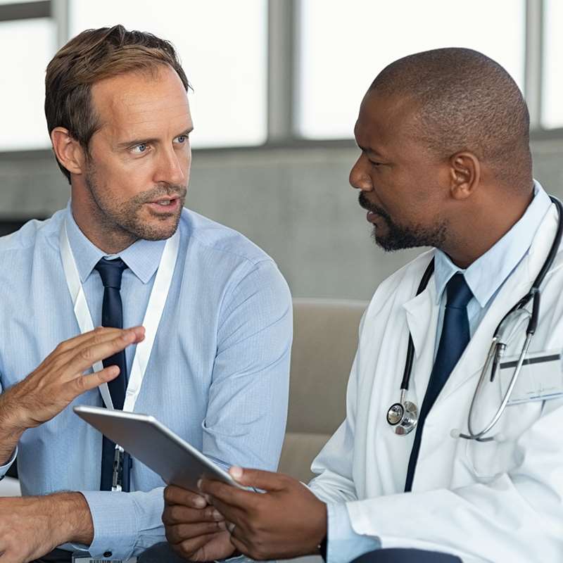 Research coordinator speaking with medical professional